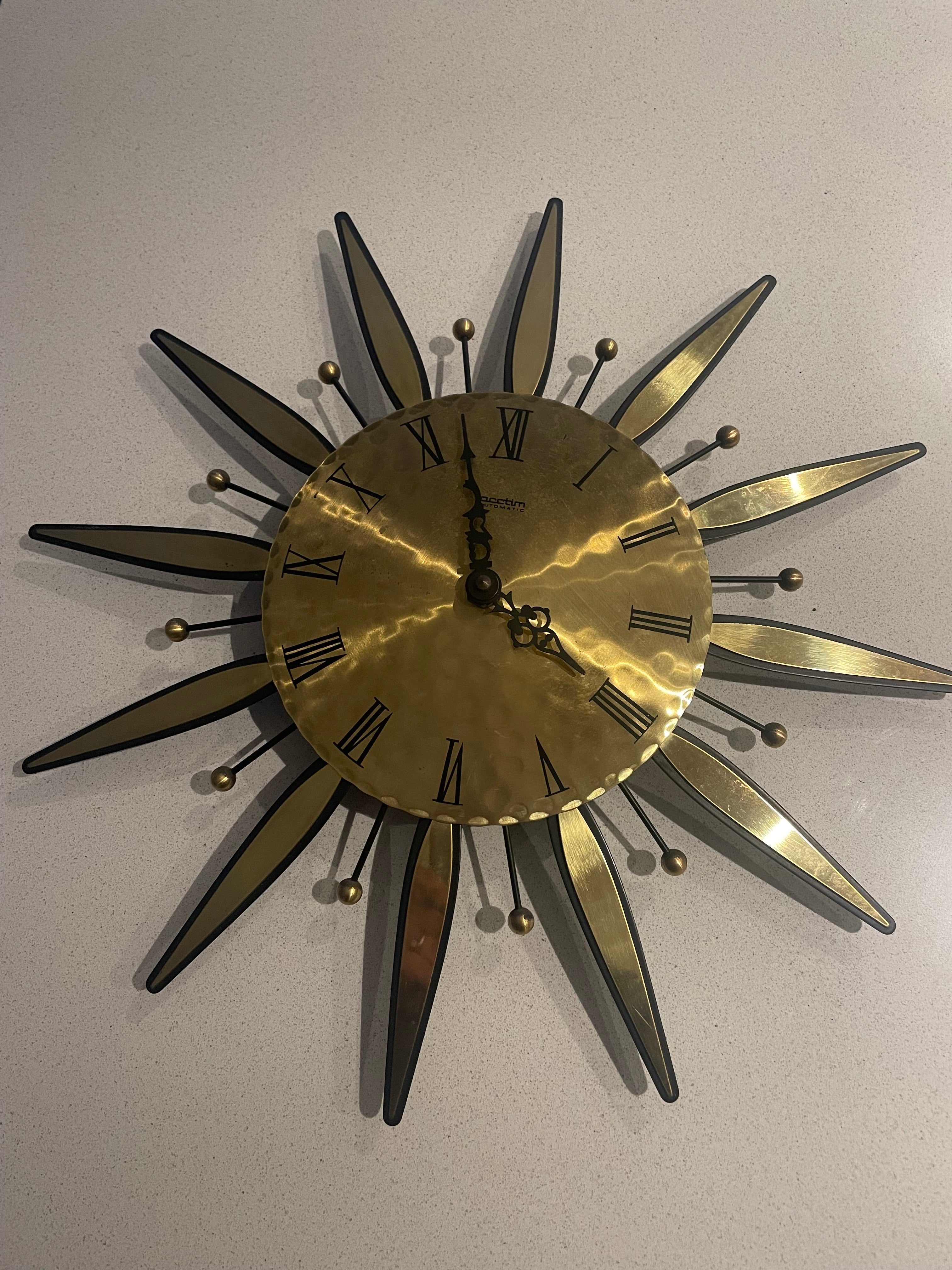 1960s Acctim automatic brass sunburst wall clock