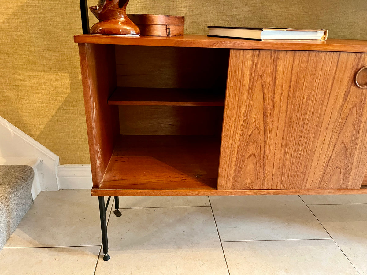Restored mid-century modern wooden Avalon and hutch with a black metal frame, featuring a top cabinet-and-shelf section and a lower drawer-and-door cabinet section.