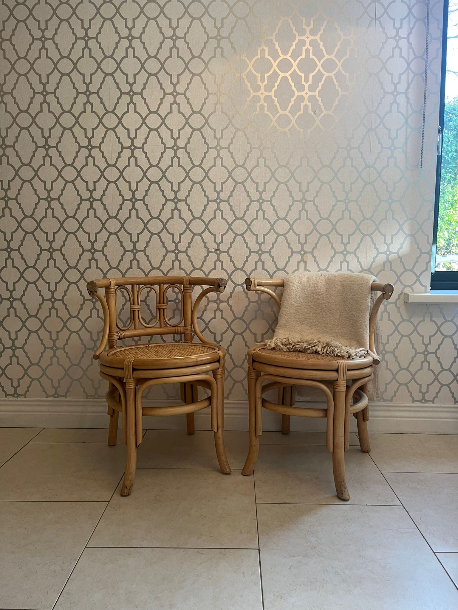 A pair of Bentwood curved cane chair