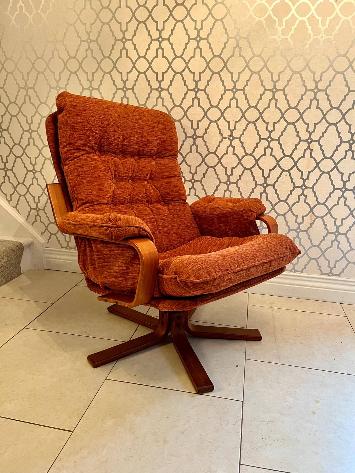A Danish style swivel armchair