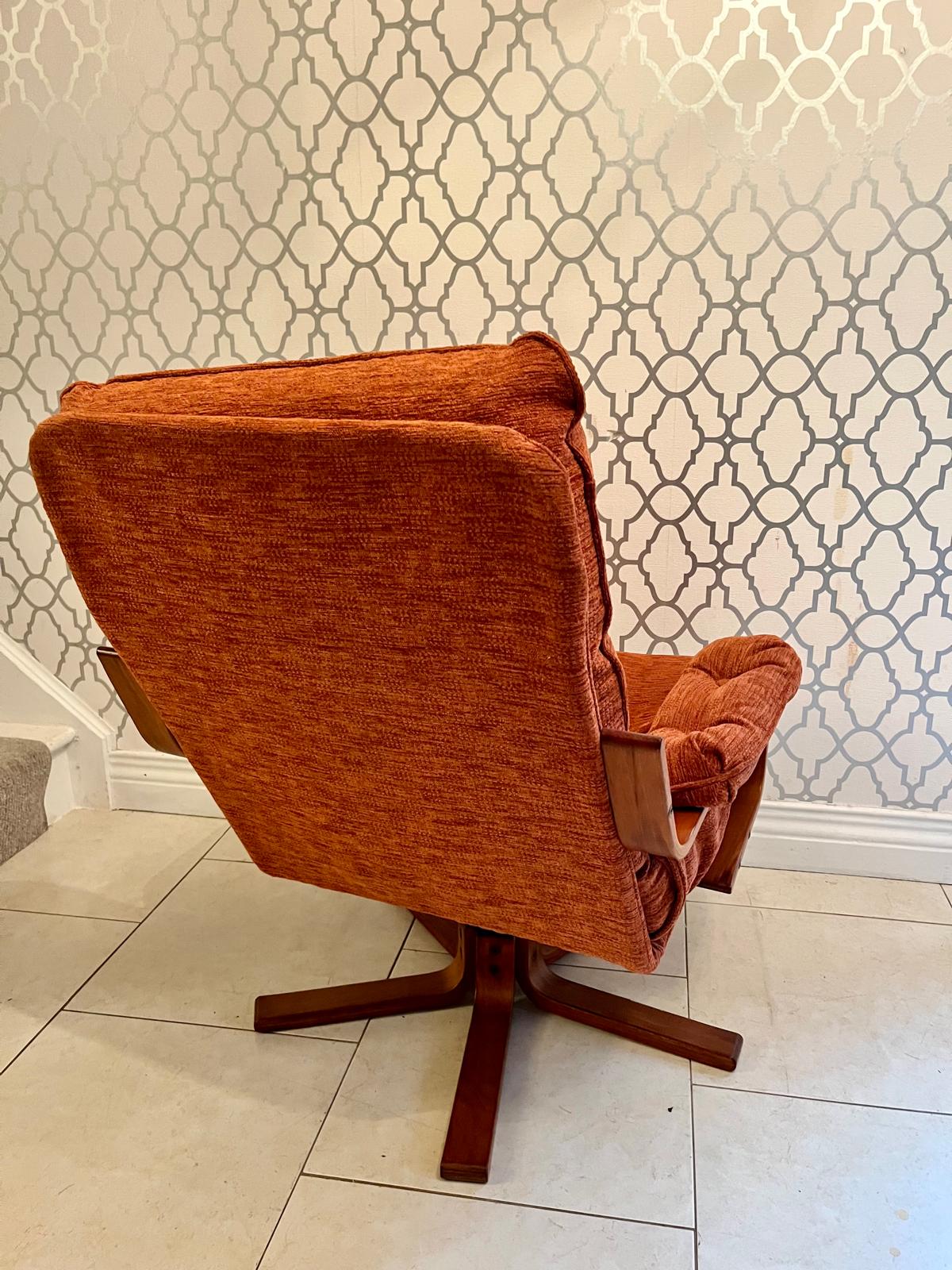 A Danish style swivel armchair