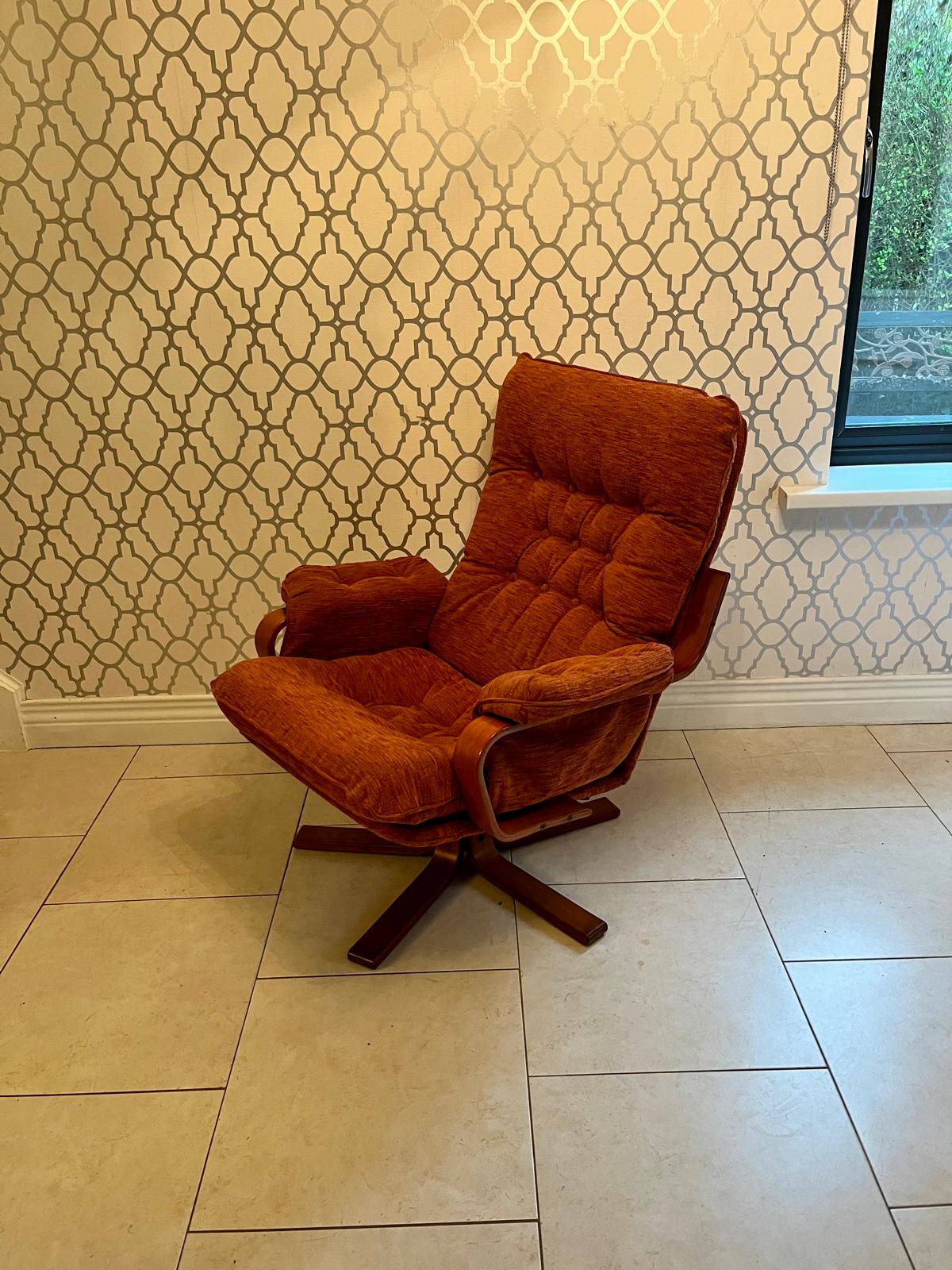 A Danish style swivel armchair