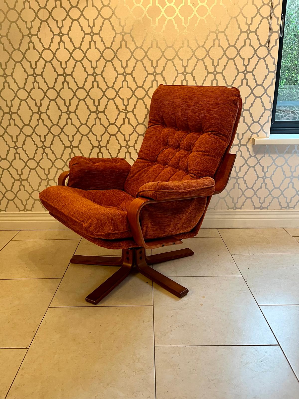A Danish style swivel armchair