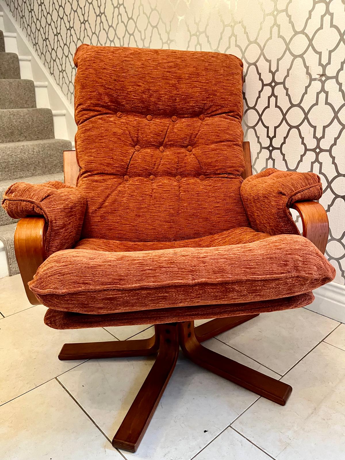 A Danish style swivel armchair