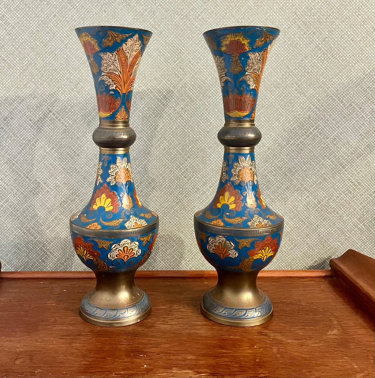 A pair of Indian enamelled brass vases
