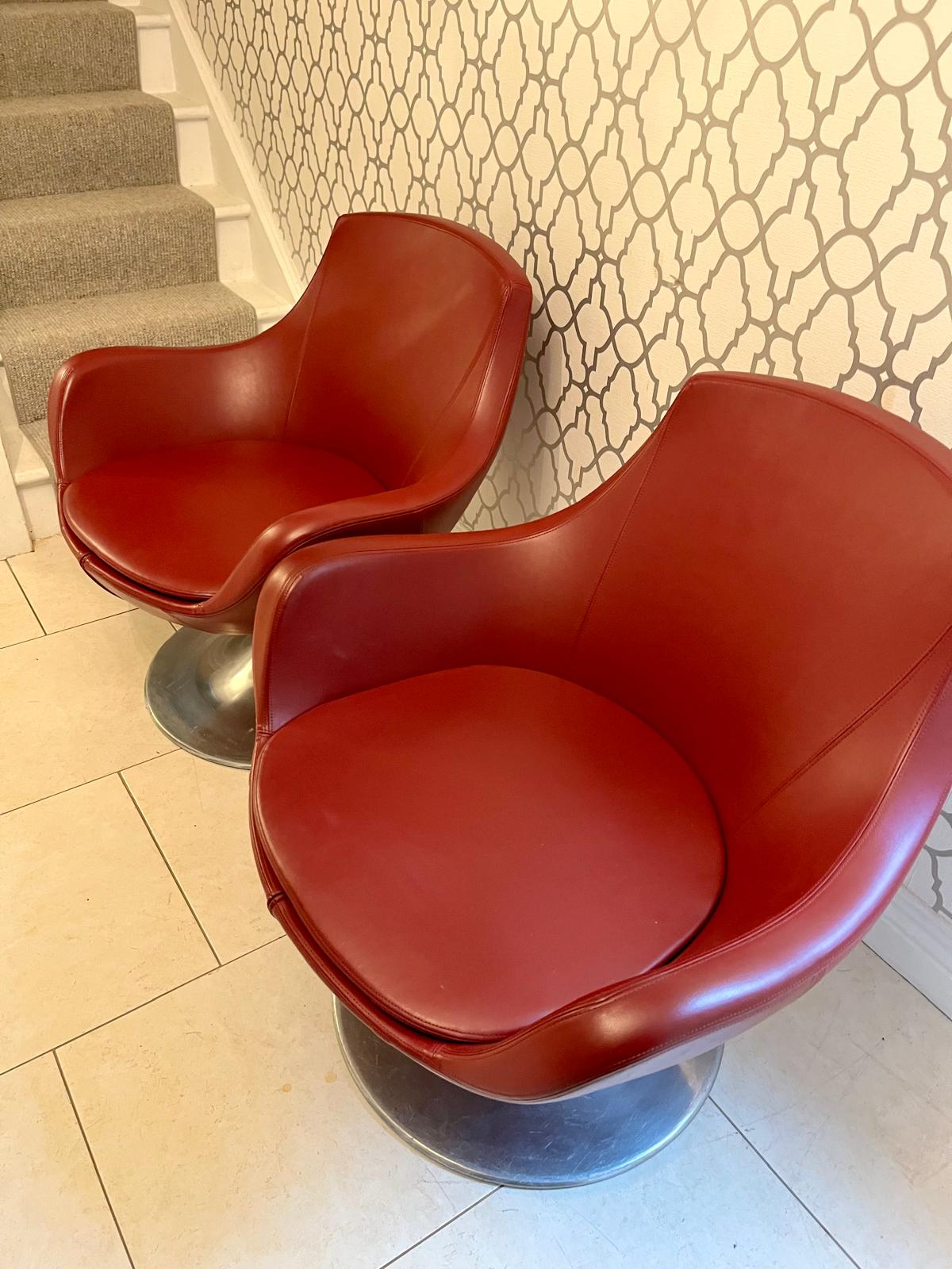Pair of Red mid century swivel egg chairs