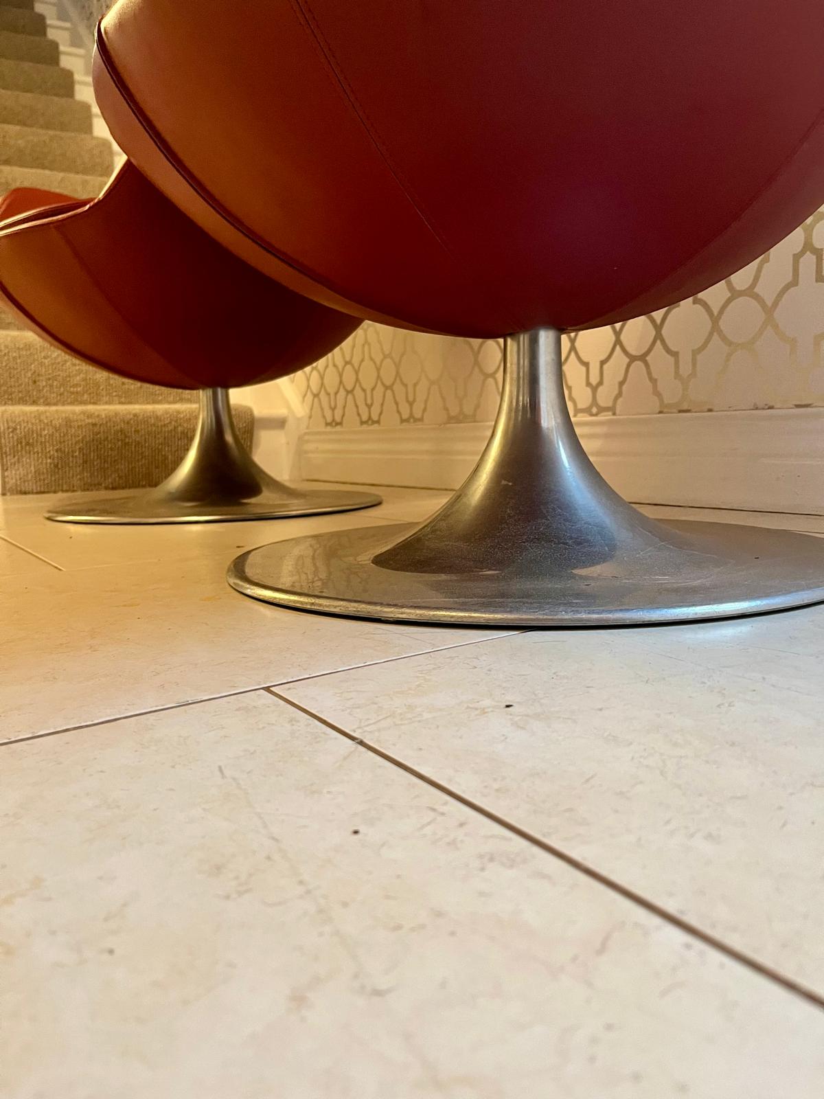 Pair of Red mid century swivel egg chairs