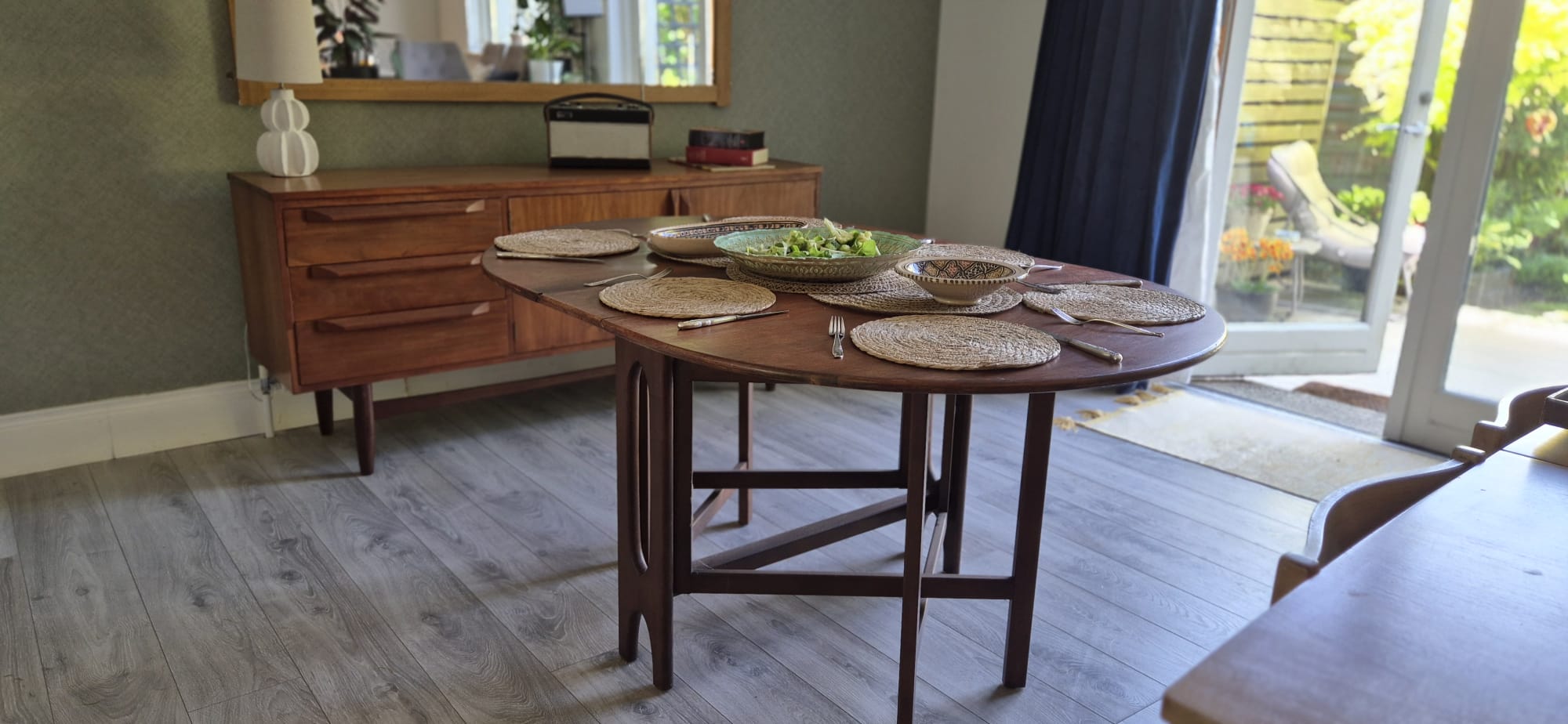 A Teak and Beech Drop Leaf Dining Table by Jentique, C.1970.