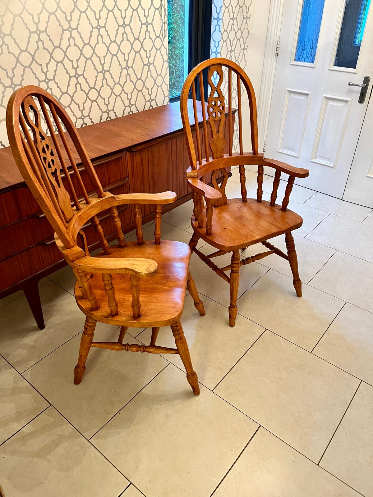 A pair of Windsor style armchairs