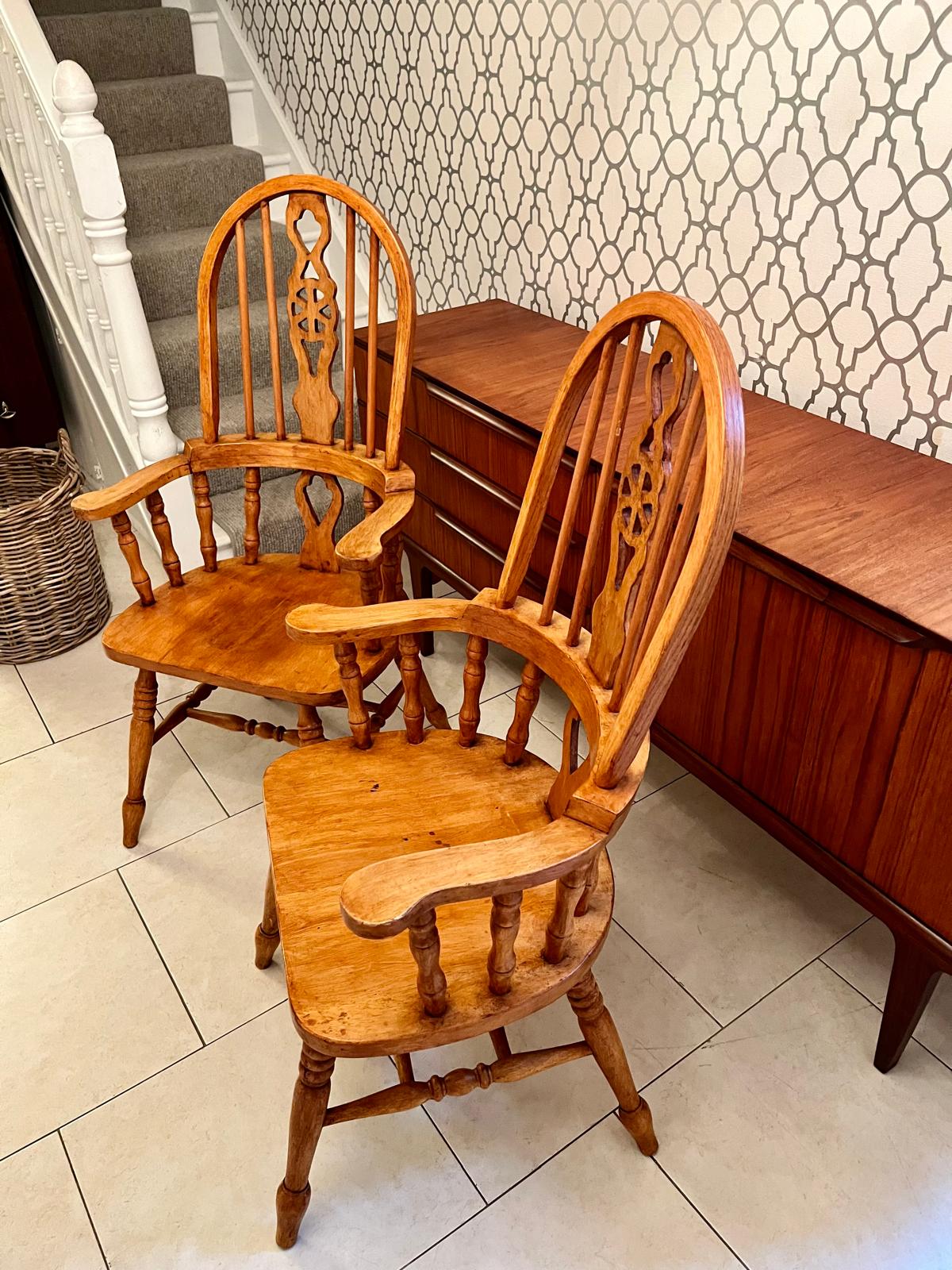 A pair of Windsor style armchairs