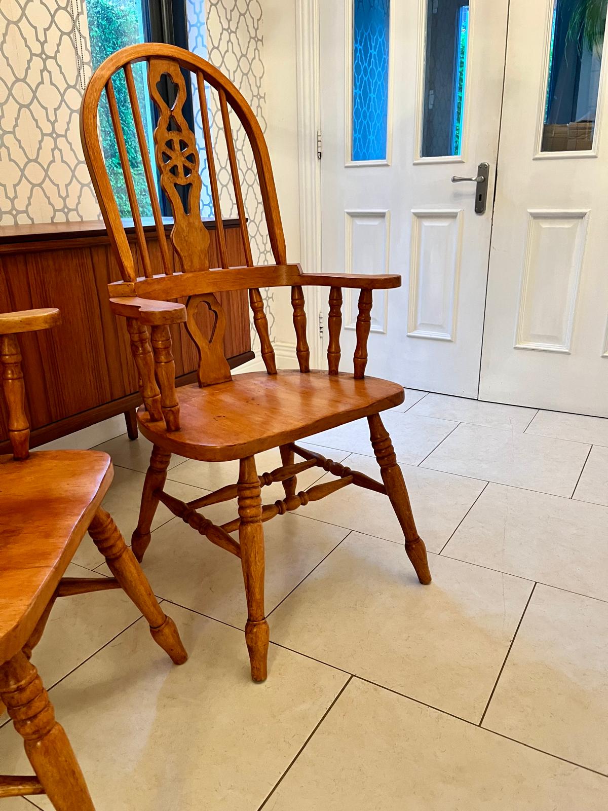 A pair of Windsor style armchairs