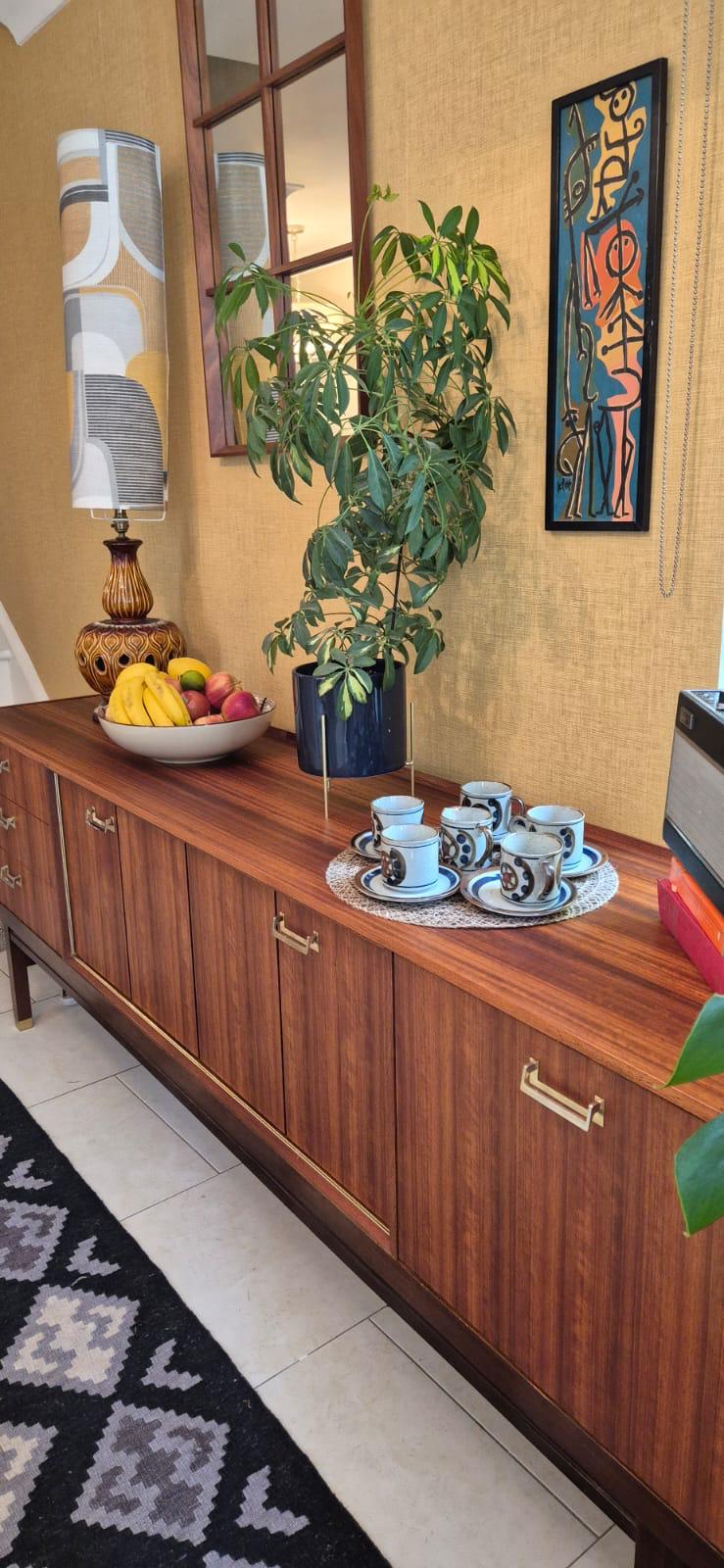 G-Plan sideboard styled with fruit bowl, plant and vintage coffee cups