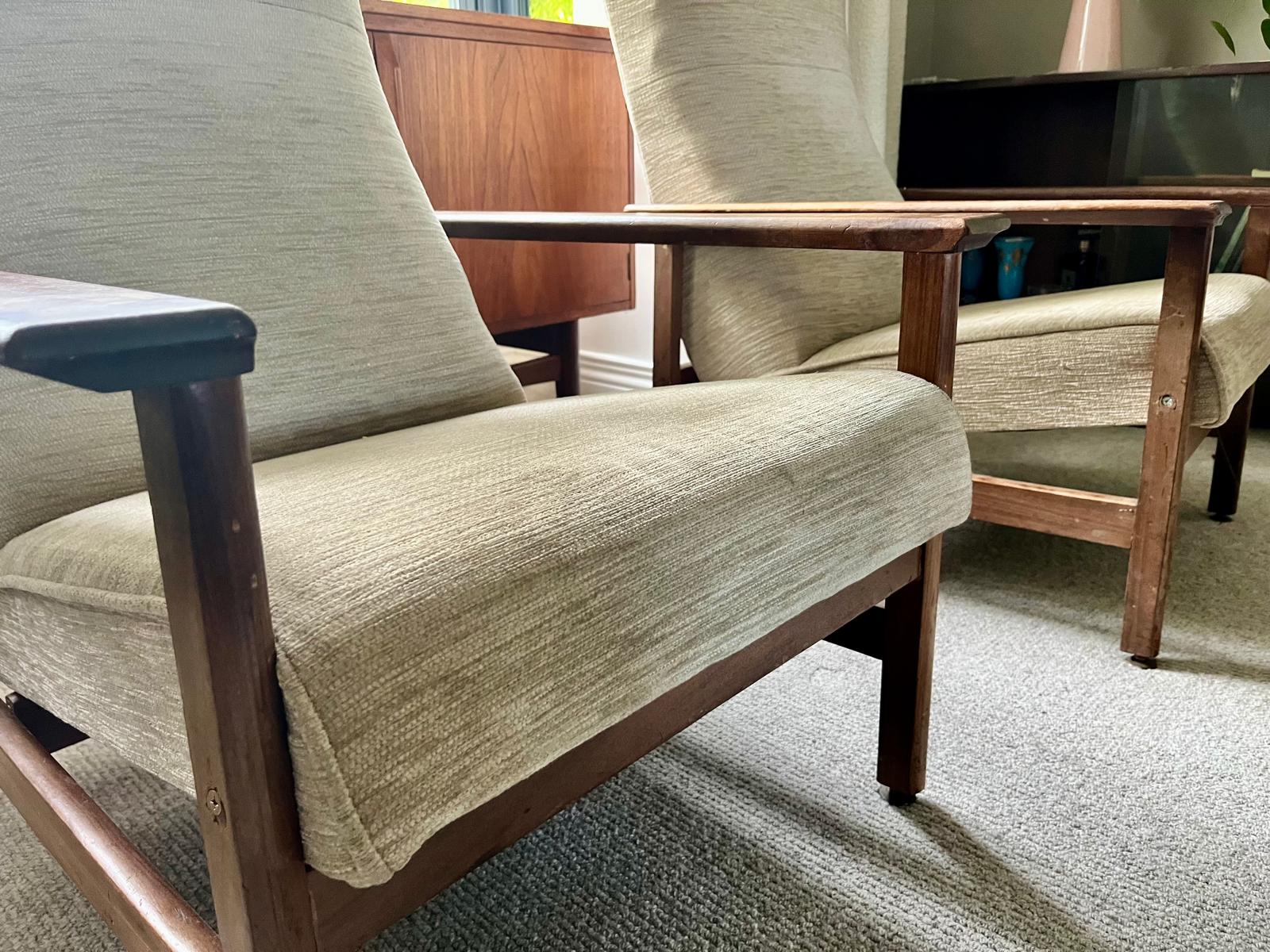 Pair of mid century armchairs with porridge fabric.