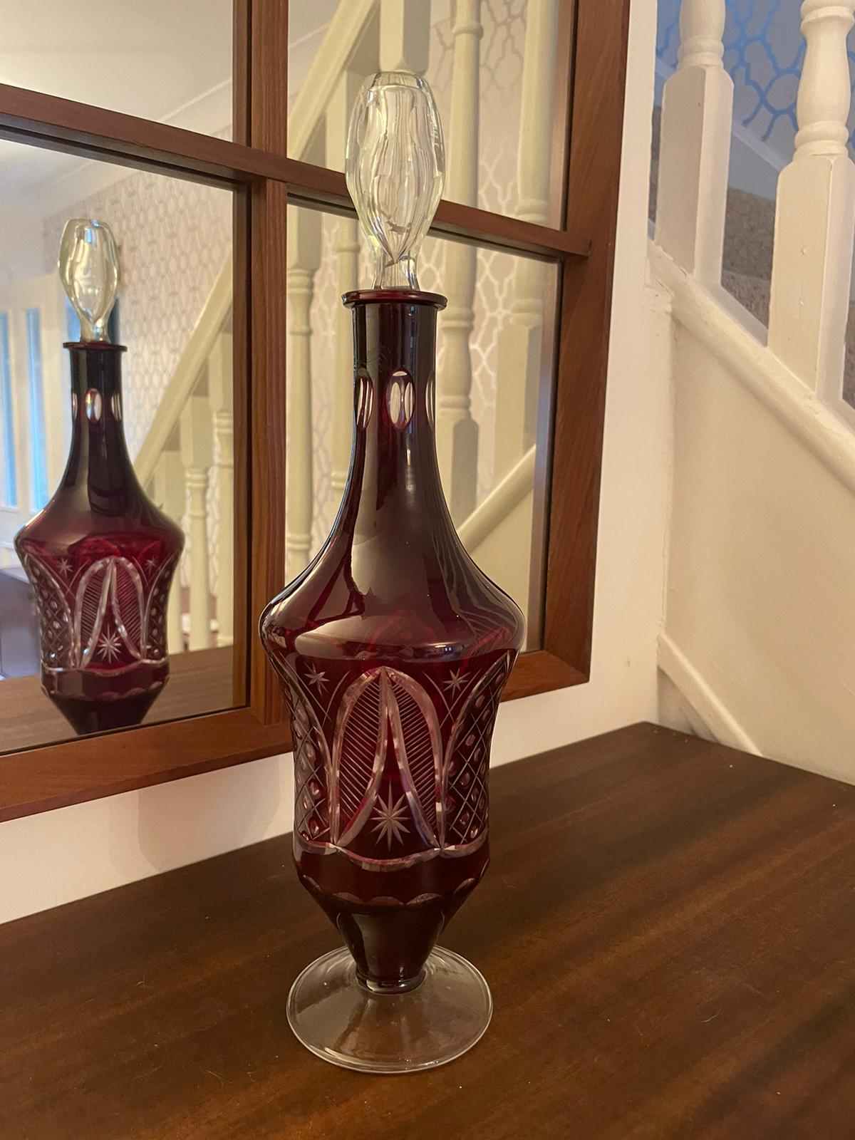A vintage Bohemian style ruby glass decanter