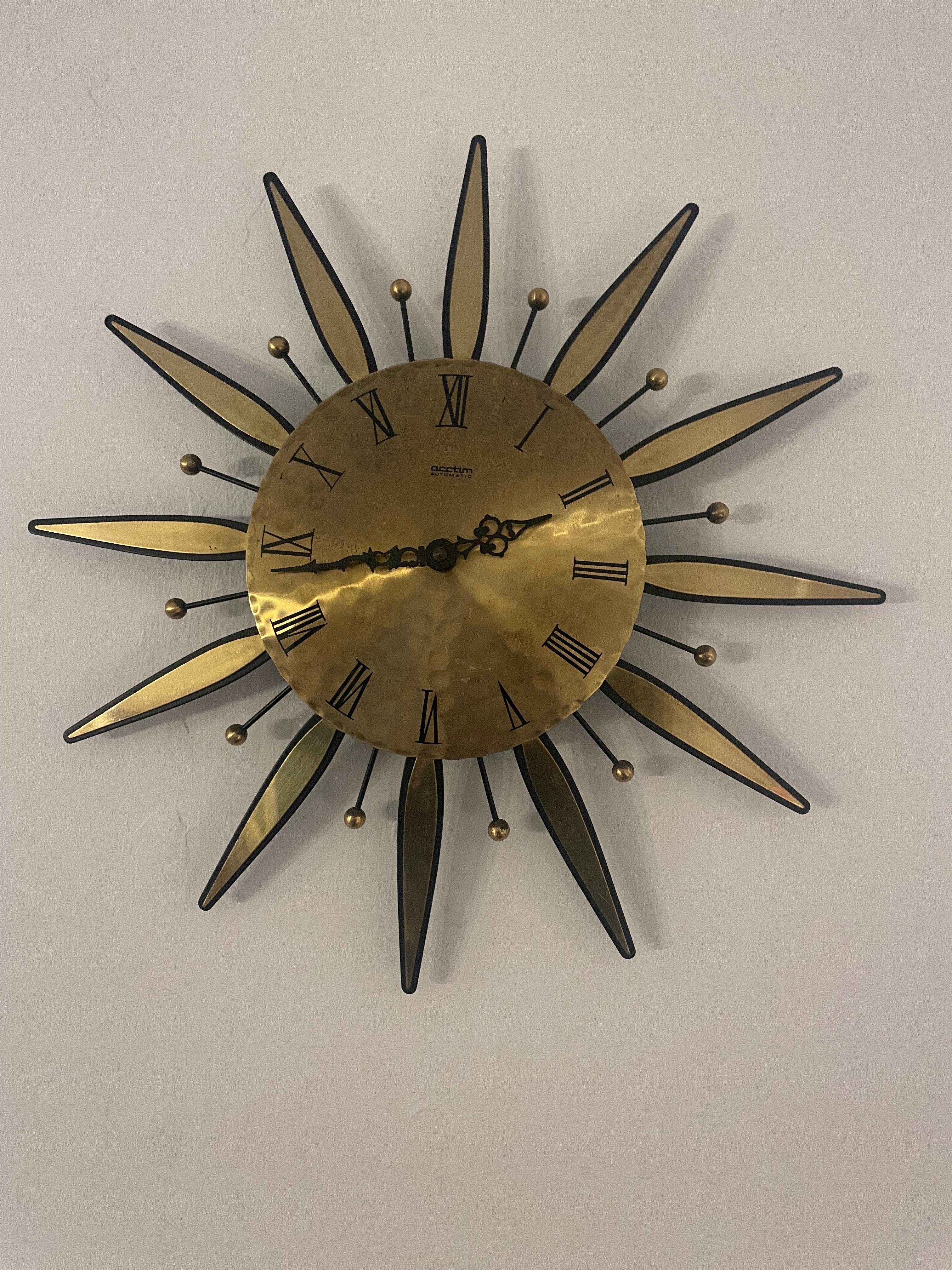 1960s Acctim automatic brass sunburst wall clock