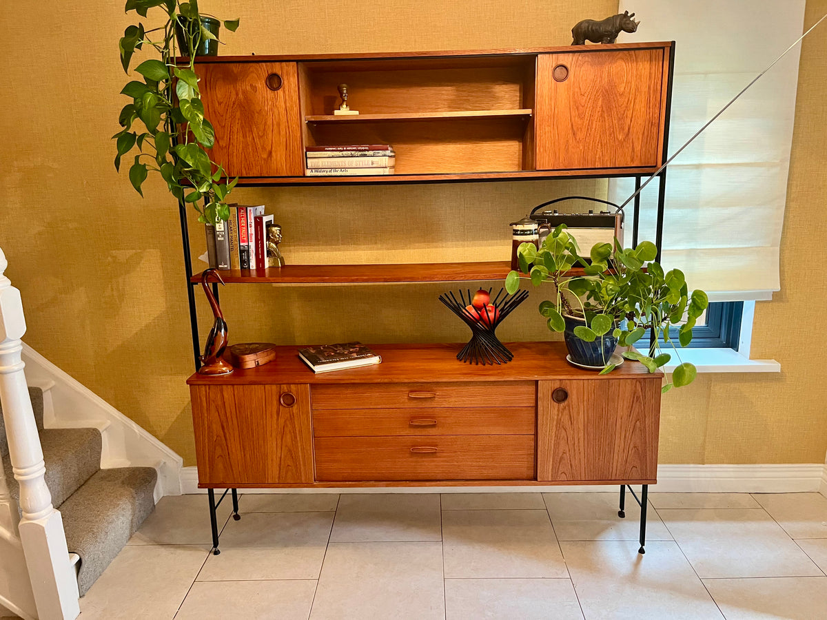 Restored mid-century modern wooden Avalon and hutch with a black metal frame, featuring a top cabinet-and-shelf section and a lower drawer-and-door cabinet section.