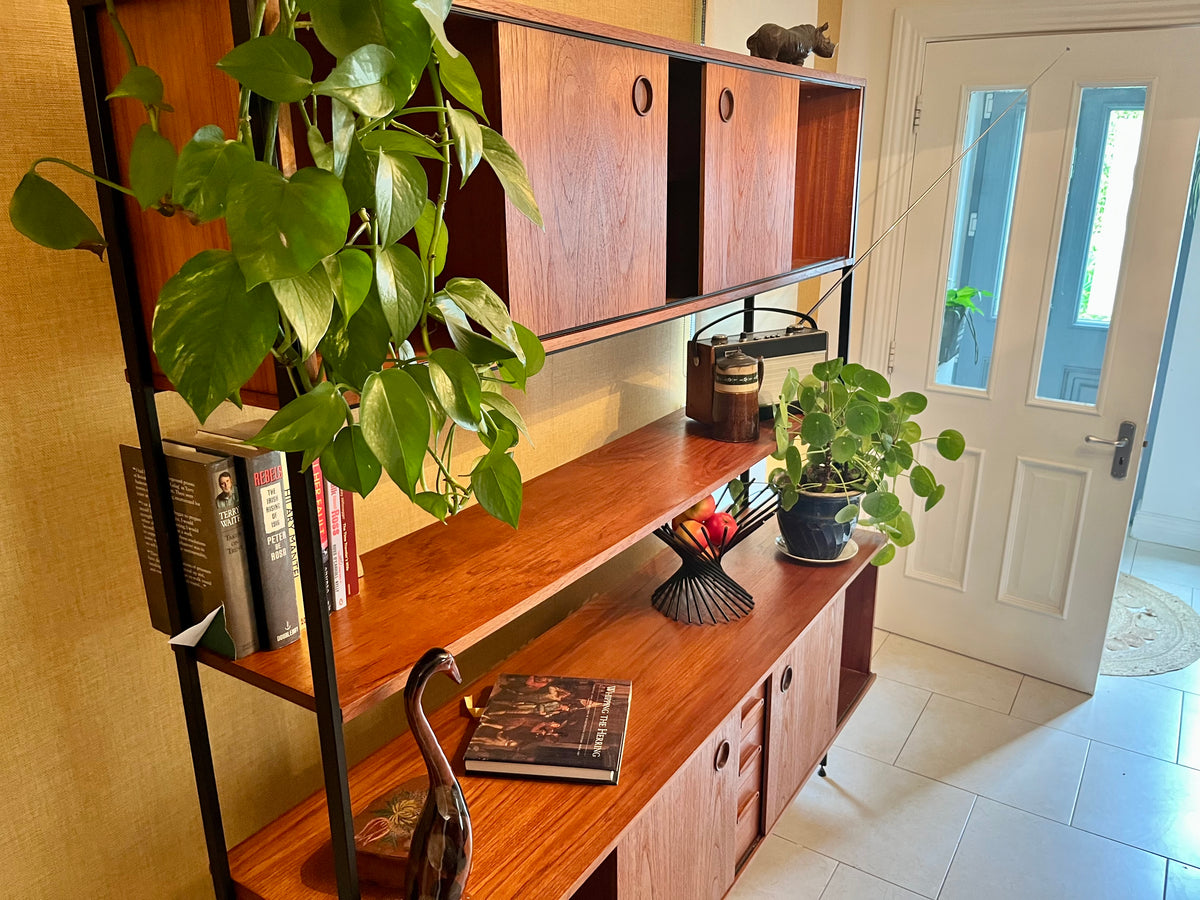 Restored mid-century modern wooden Avalon and hutch with a black metal frame, featuring a top cabinet-and-shelf section and a lower drawer-and-door cabinet section.