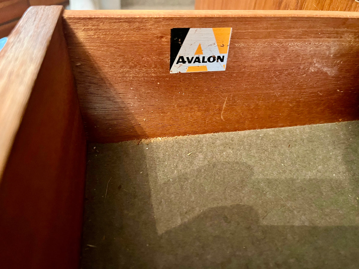Restored mid-century modern wooden Avalon and hutch with a black metal frame, featuring a top cabinet-and-shelf section and a lower drawer-and-door cabinet section.