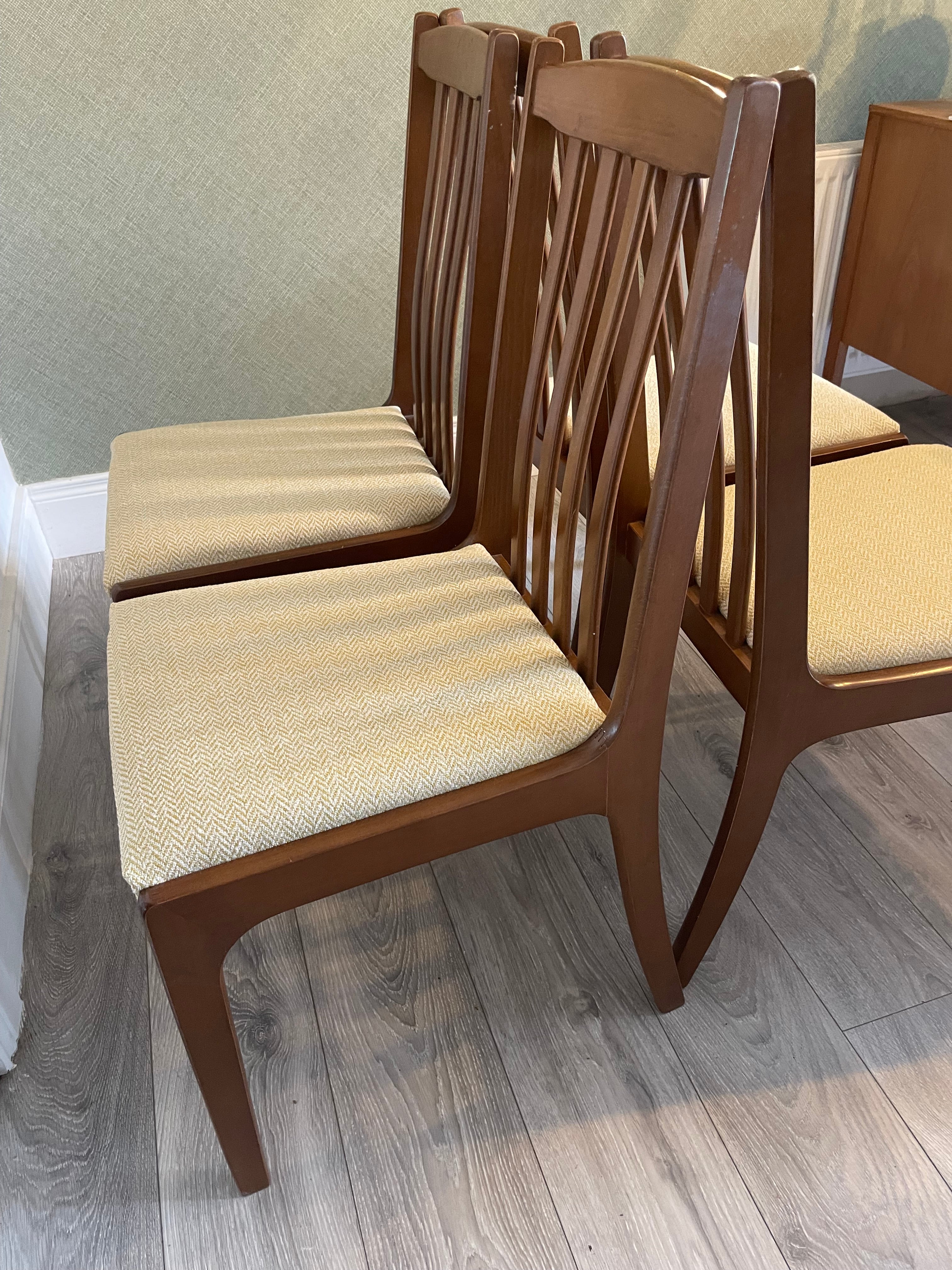 Four re-upholstered dining chairs covered in a pale lemon fabric by Grace & Joy Furniture