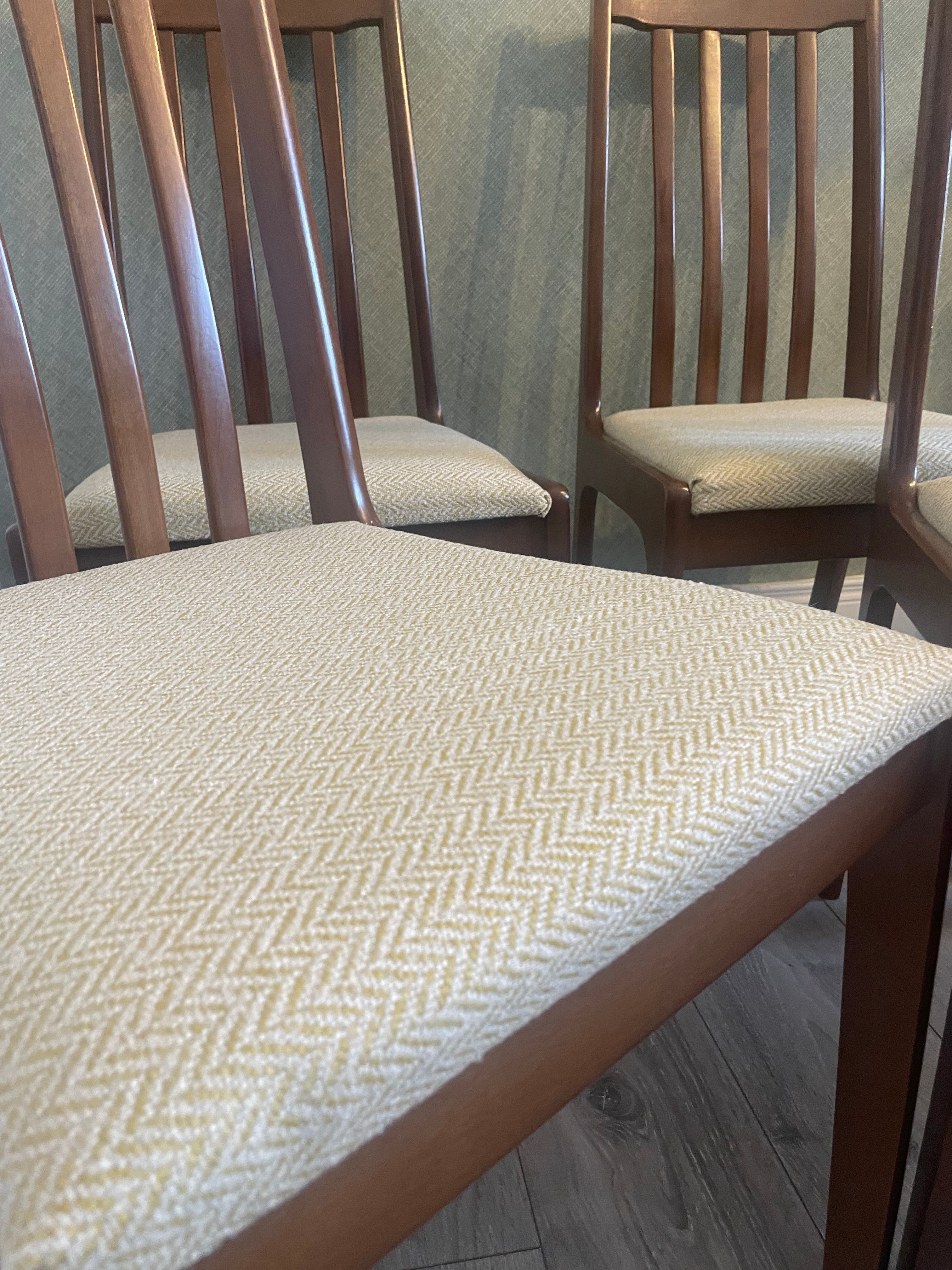 Four re-upholstered dining chairs covered in a pale lemon fabric by Grace & Joy Furniture
