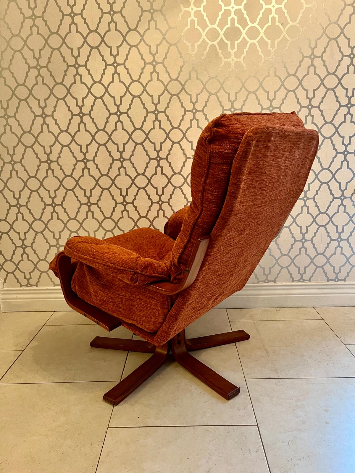 A Danish style swivel armchair