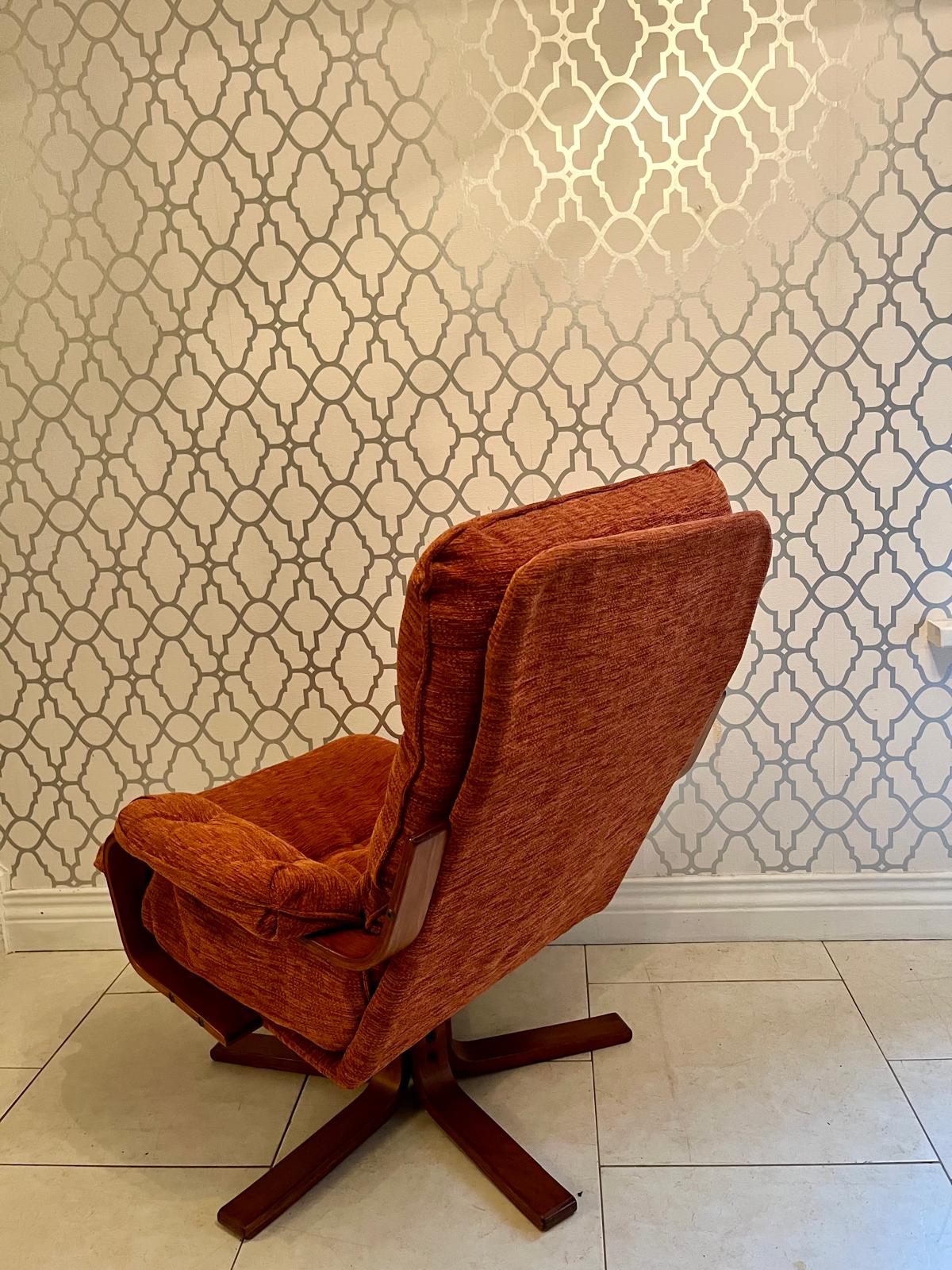 A Danish style swivel armchair