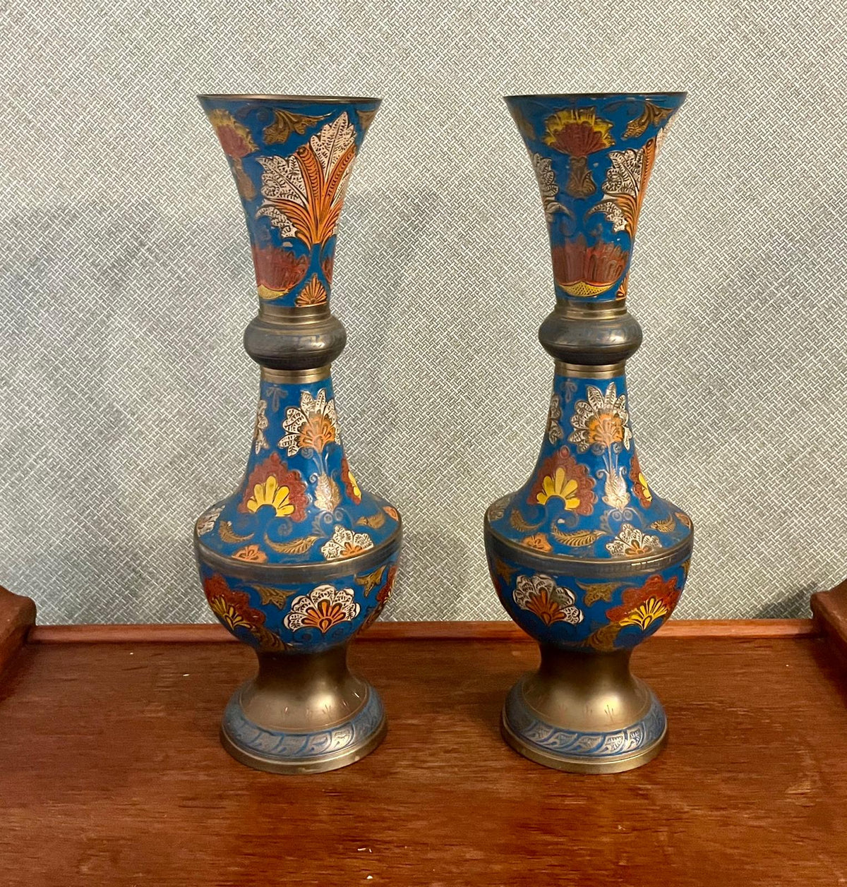 A pair of Indian enamelled brass vases