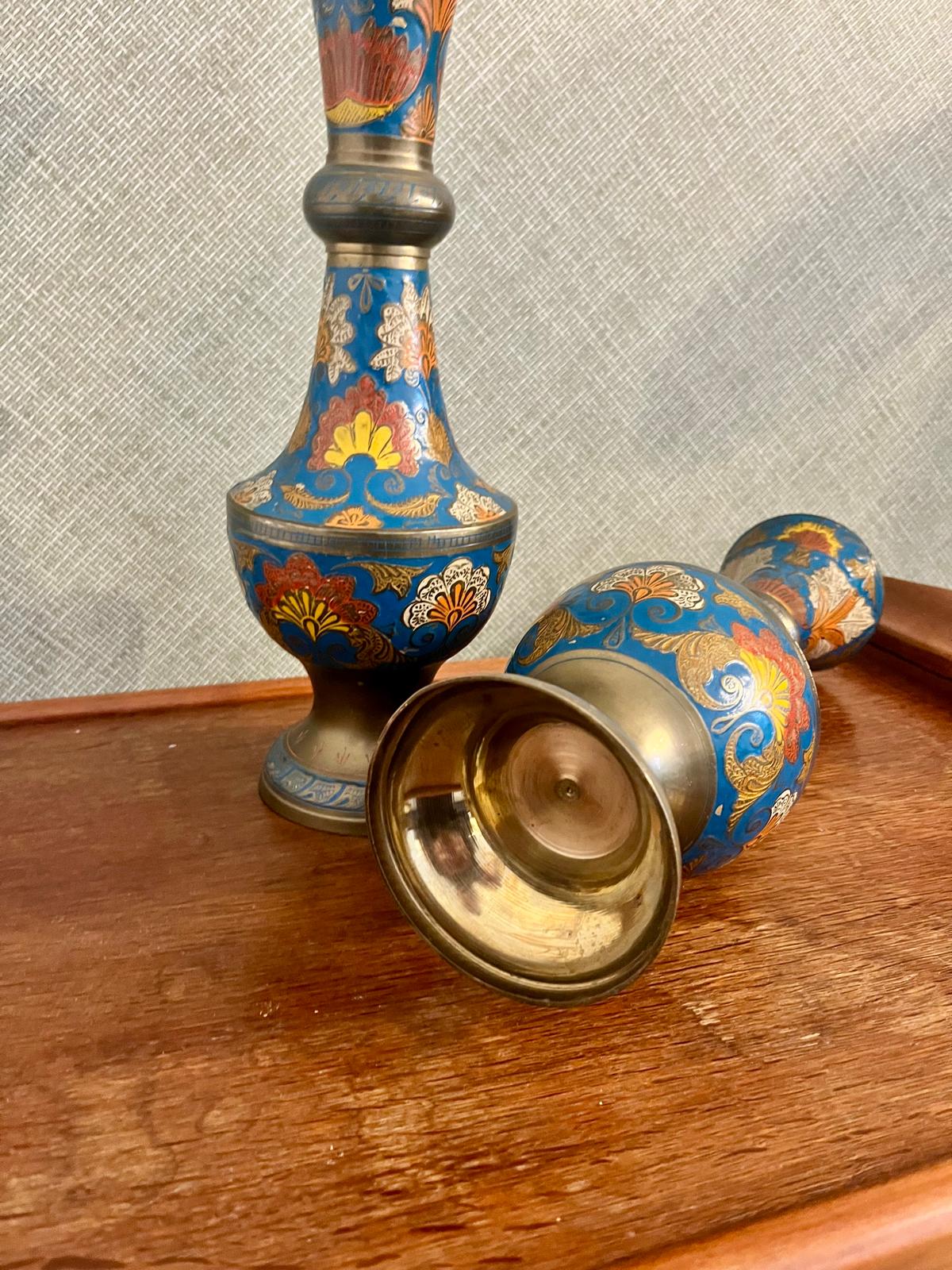 A pair of Indian enamelled brass vases