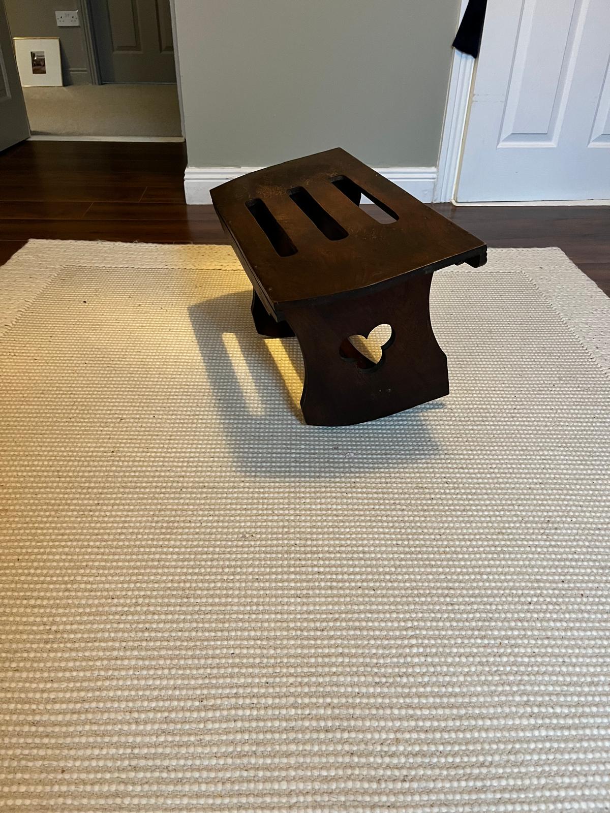 A Rustic elm rocking stool